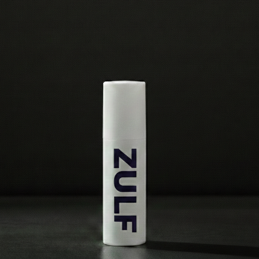 White cylindrical object with 'Nule' branding on a black background